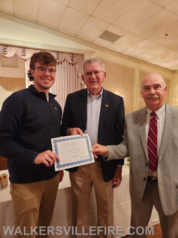 Ayden Shadle (Left) is presented with the Vaughn Zimmerman Scholarship. Pictured with Vaughn Zimmerman and Vice President Brian Hildebrand.