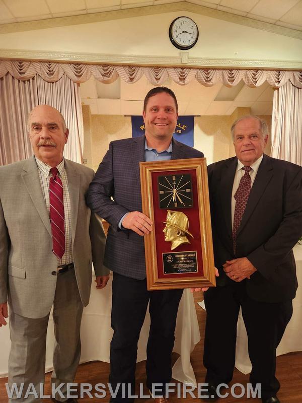 Chad Barrick (center) receives Honorary Life Membership. Pictured with Vice President Brian Hildebrand and President Jim Graham.